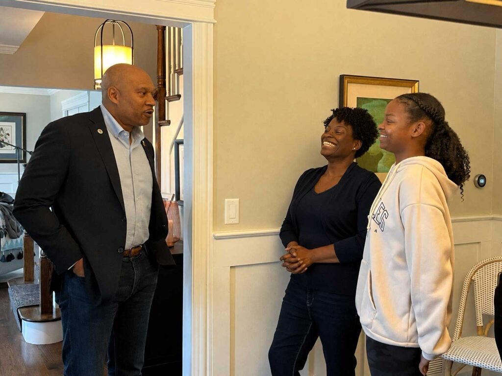 Benny White for Naperville Mayor talks to his supporters